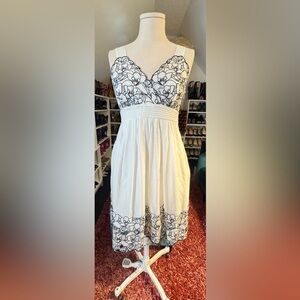 INC White Cotton Empire Waist Dress with Black Embroidered Detail.